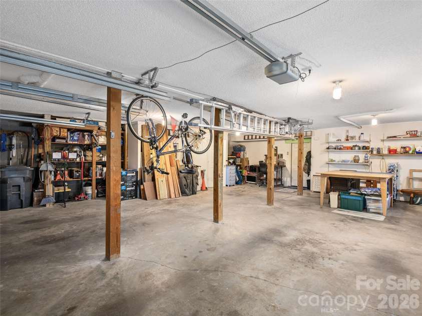 23 Old Applewood Lane, Hendersonville, NC 28739.  MLS# CAR4432097, YatesRealty ID 55107. Oversized Two-Car Garage with Workshop