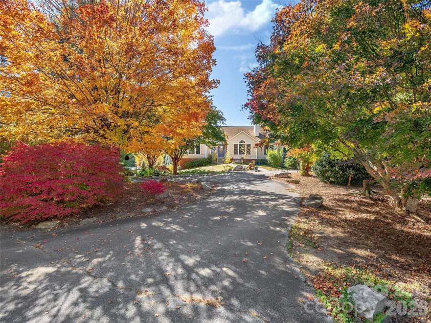23 Old Applewood Lane, Hendersonville, NC 28739.  MLS# CAR4432097, YatesRealty ID 55107. Tree-Lined Circular Drive