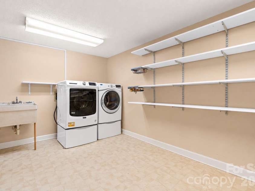18 Northwood Road, Asheville, NC 28804.  MLS# CAR4429580, YatesRealty ID 55146. Lower level laundry room