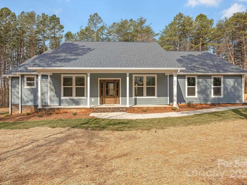 326 Lewis Ferry Road, Statesville, NC 28677.  MLS# CAR4228140, YatesRealty ID 5515. 2,260 heated upgraded living area, oversized side load garage with 8 ft tall doors (not standard 7 ft).