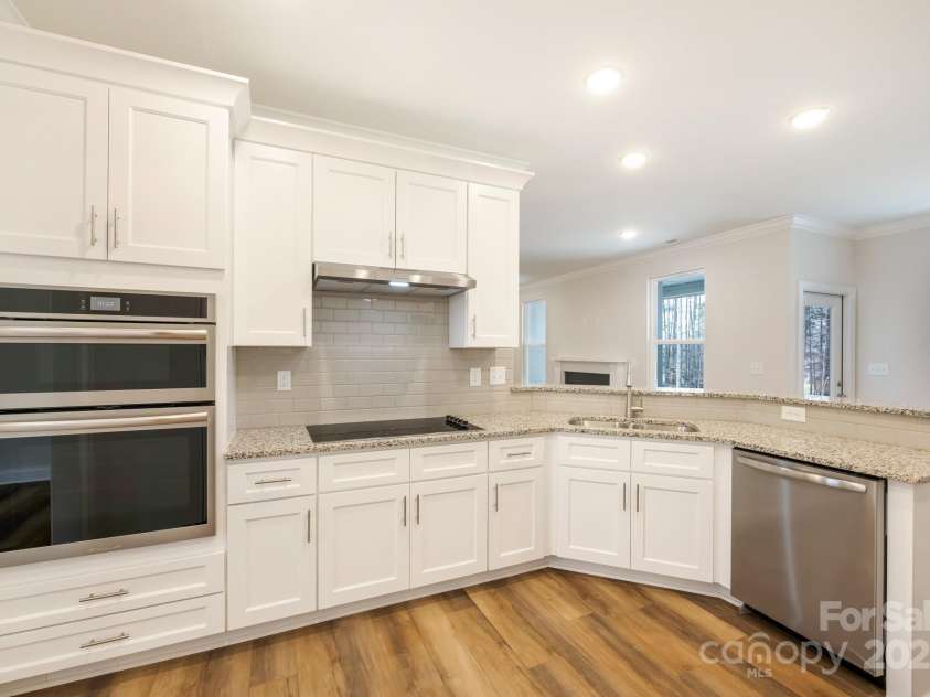 326 Lewis Ferry Road, Statesville, NC 28677.  MLS# CAR4228140, YatesRealty ID 5515. Soft close cabinets, stainless steel appliances sink overlooks the backyard