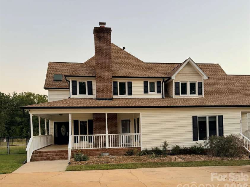 2129 Squire Road, Rock Hill, SC 29730.  MLS# CAR4423271, YatesRealty ID 55156. Front/side of home at dusk.