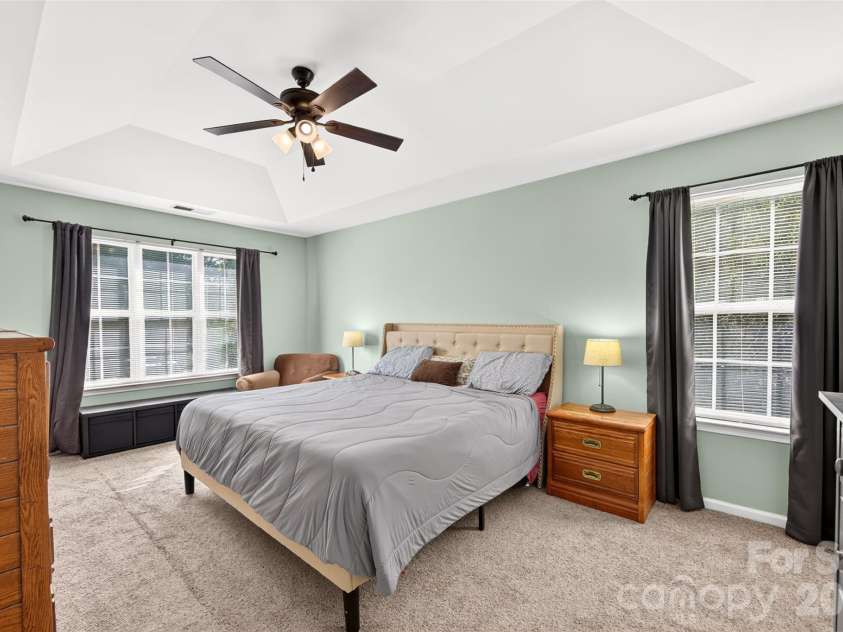 7609 Berrywood Circle, Huntersville, NC 28078.  MLS# CAR4430975, YatesRealty ID 55171. Spacious primary bedroom with tray ceiling.
