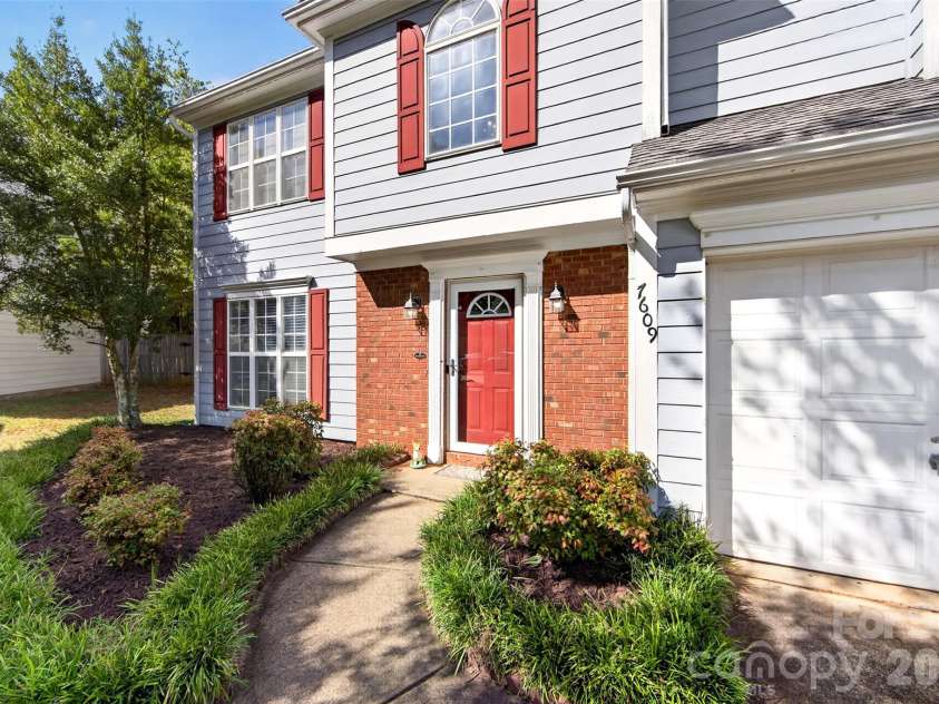7609 Berrywood Circle, Huntersville, NC 28078.  MLS# CAR4430975, YatesRealty ID 55171. Walkway leading to front door/stoop.