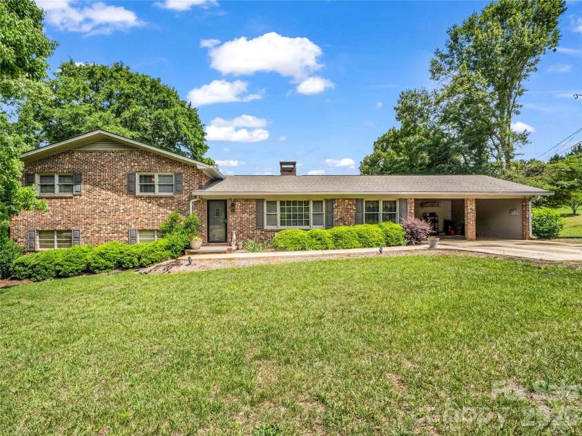 72 & 90 McEntire Road, Tryon, NC 28782.  MLS# CAR4385841, YatesRealty ID 55174. Front of main residence
