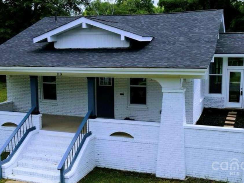 113 Brawley Street, Chester, SC 29706.  MLS# CAR4228176, YatesRealty ID 5521. Rocking chair front porch