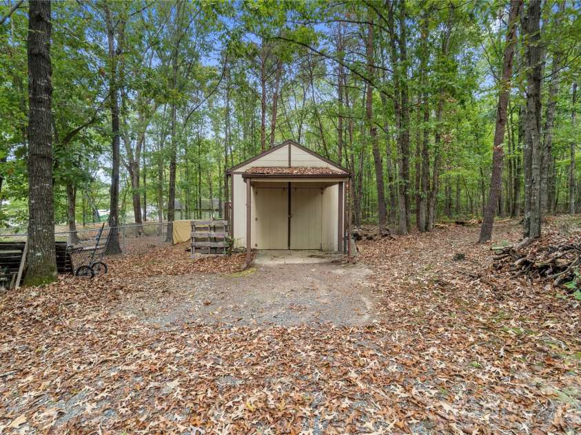 15810 Silver Road, Oakboro, NC 28129.  MLS# CAR4432319, YatesRealty ID 55223. Backyard with workshop
