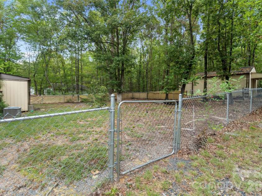 15810 Silver Road, Oakboro, NC 28129.  MLS# CAR4432319, YatesRealty ID 55223. Fenced Backyard