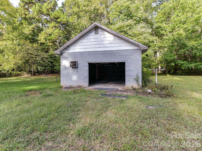 205 Oakland Street, Locust, NC 28097.  MLS# CAR4430849, YatesRealty ID 55225. Detached Garage