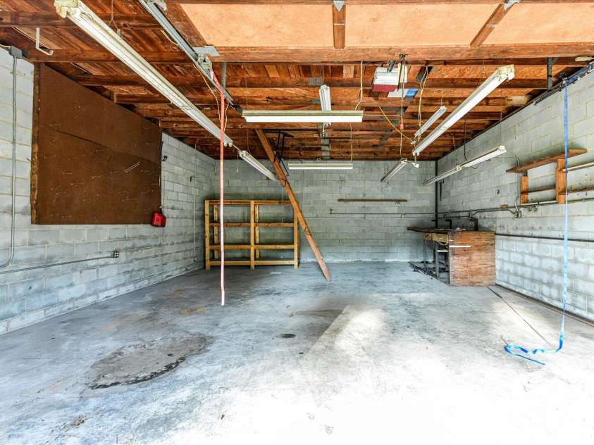 205 Oakland Street, Locust, NC 28097.  MLS# CAR4430849, YatesRealty ID 55225. Oversized Garage with Storage