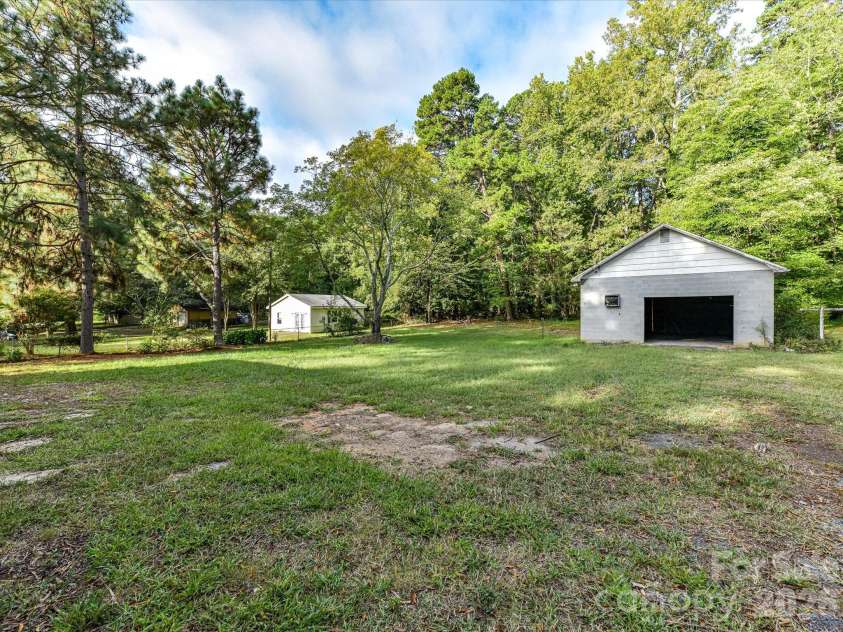 205 Oakland Street, Locust, NC 28097.  MLS# CAR4430849, YatesRealty ID 55225. Yard