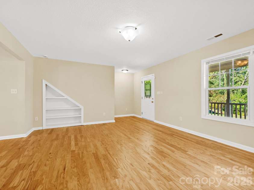 81 Crayton Road, Asheville, NC 28803.  MLS# CAR4432139, YatesRealty ID 55230. Book shelves