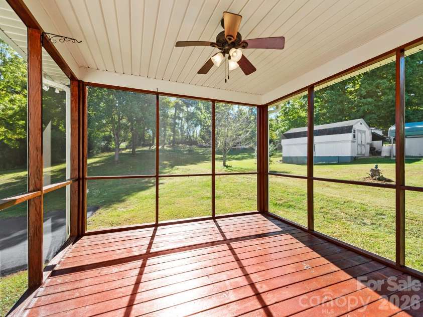81 Crayton Road, Asheville, NC 28803.  MLS# CAR4432139, YatesRealty ID 55230. Covered screened in back deck