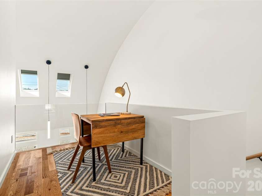 6 Roberts Street, Asheville, NC 28801.  MLS# CAR4431489, YatesRealty ID 55241. Loft area on upper level with skylights.