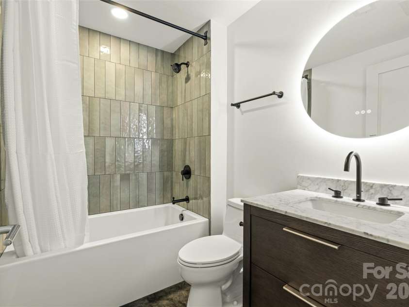 6 Roberts Street, Asheville, NC 28801.  MLS# CAR4431489, YatesRealty ID 55241. Lower level full bathroom.