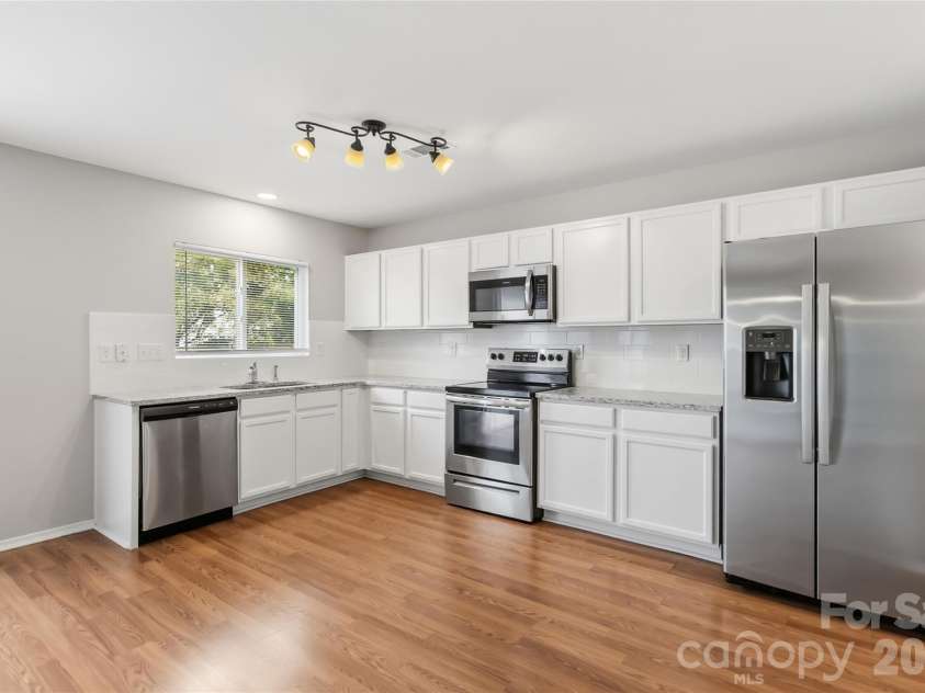 6215 Woodland Commons Drive, Charlotte, NC 28269.  MLS# CAR4432348, YatesRealty ID 55242. 