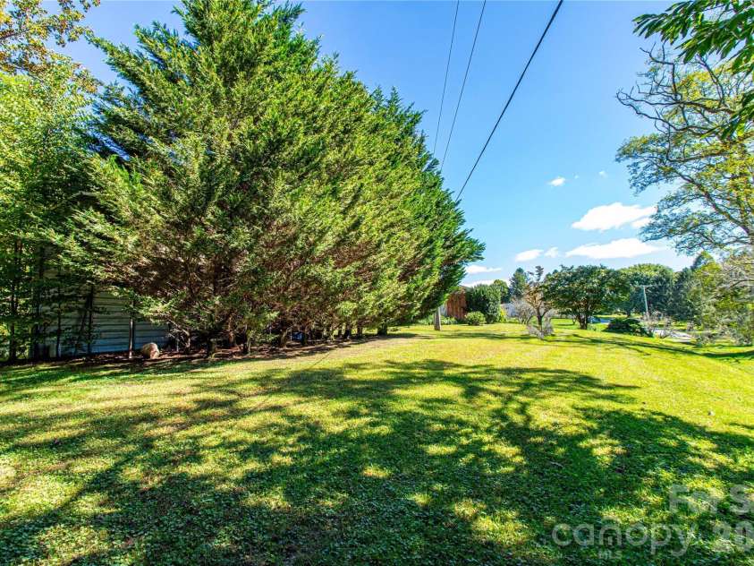 2586 Kim Miller Road, Lake Toxaway, NC 28747.  MLS# CAR4431012, YatesRealty ID 55249. Side yard