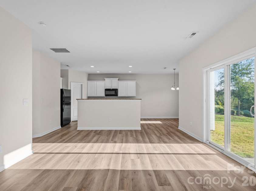 6215 Paw Village Road, Charlotte, NC 28214.  MLS# CAR4432466, YatesRealty ID 55279. Dining and kitchen without virtual staging