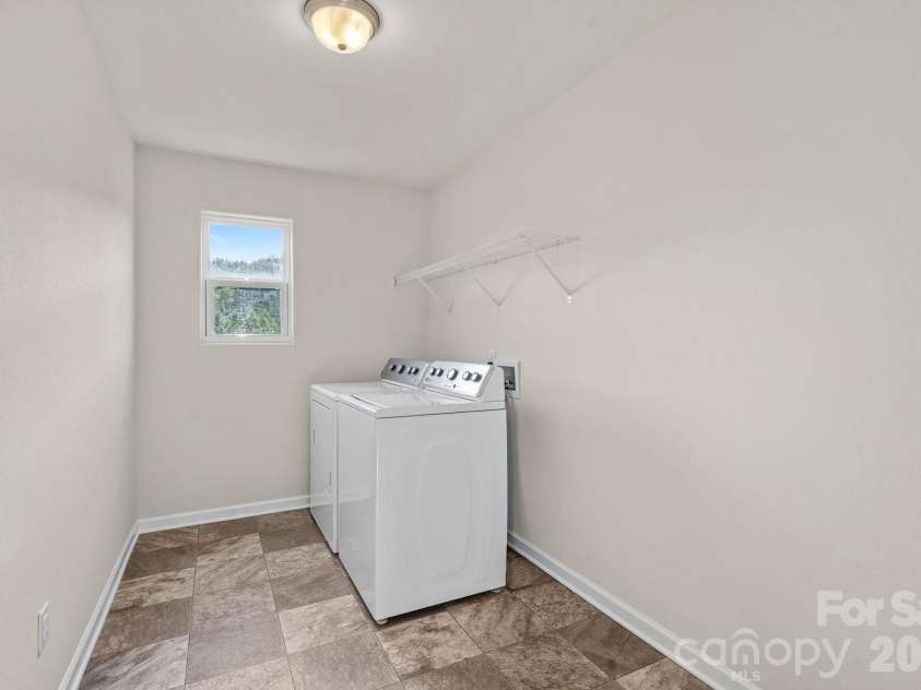 6215 Paw Village Road, Charlotte, NC 28214.  MLS# CAR4432466, YatesRealty ID 55279. Laundry room