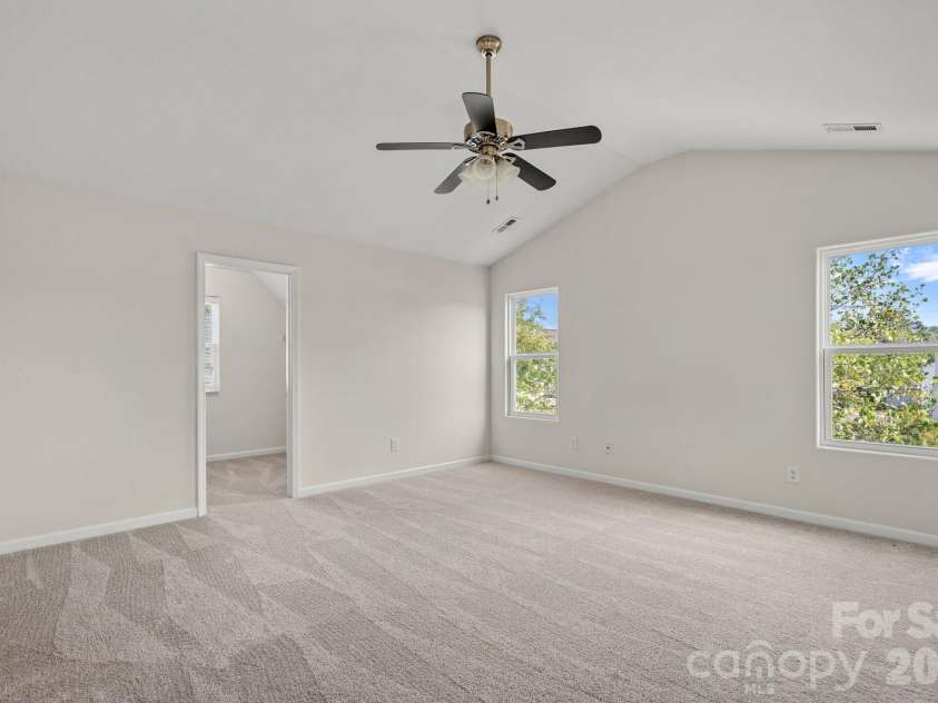 6215 Paw Village Road, Charlotte, NC 28214.  MLS# CAR4432466, YatesRealty ID 55279. Primary bedroom with vaulted ceiling - without virtual  staging