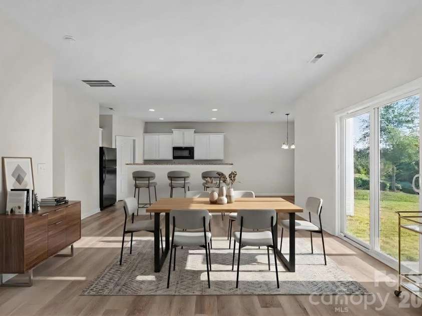 6215 Paw Village Road, Charlotte, NC 28214.  MLS# CAR4432466, YatesRealty ID 55279. Virtually staged - Dining and kitchen