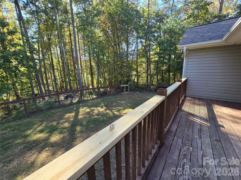 15 Tiki Way, Candler, NC 28715.  MLS# CAR4422310, YatesRealty ID 55288. Back deck and yard