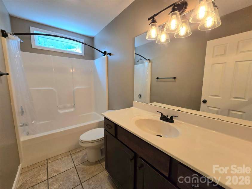 15 Tiki Way, Candler, NC 28715.  MLS# CAR4422310, YatesRealty ID 55288. Guest bath