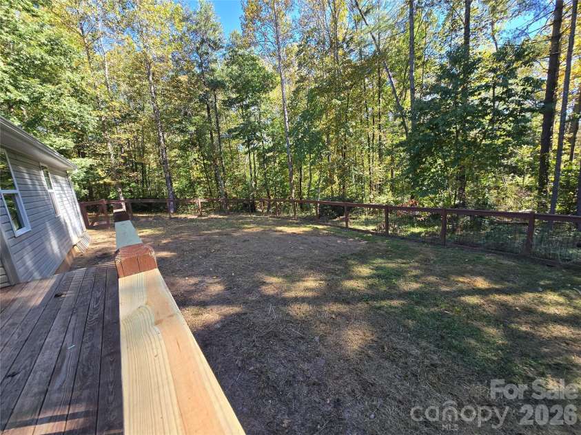 15 Tiki Way, Candler, NC 28715.  MLS# CAR4422310, YatesRealty ID 55288. Large back fenced area