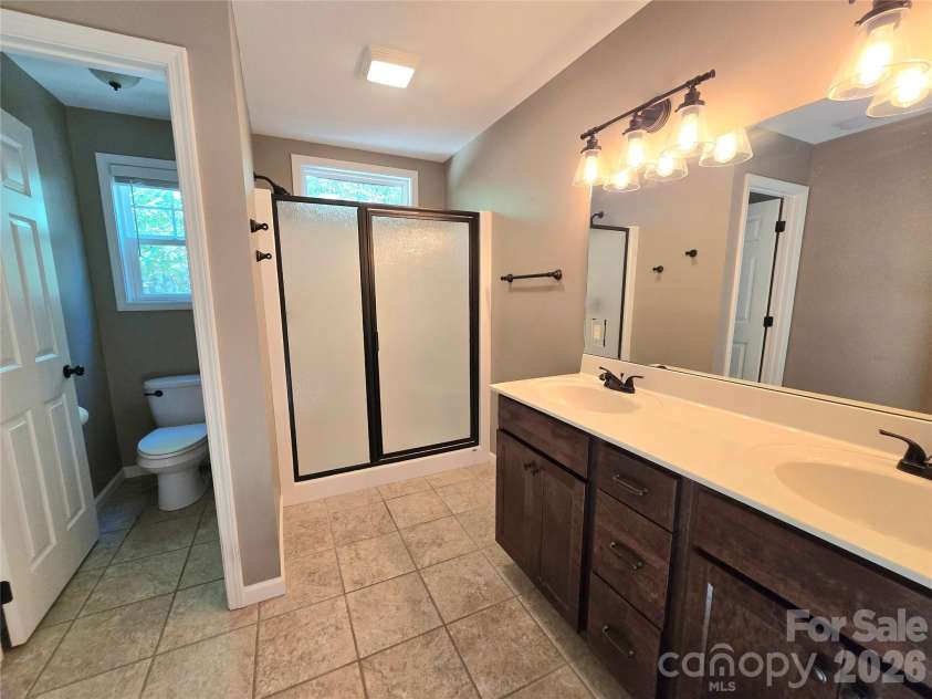 15 Tiki Way, Candler, NC 28715.  MLS# CAR4422310, YatesRealty ID 55288. Primary bath