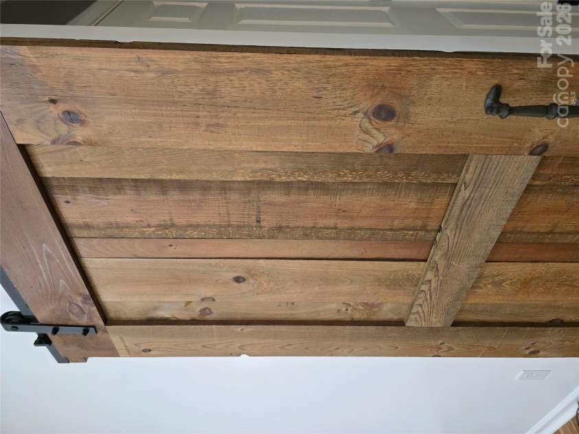 15 Tiki Way, Candler, NC 28715.  MLS# CAR4422310, YatesRealty ID 55288. Real wood matching barn doors