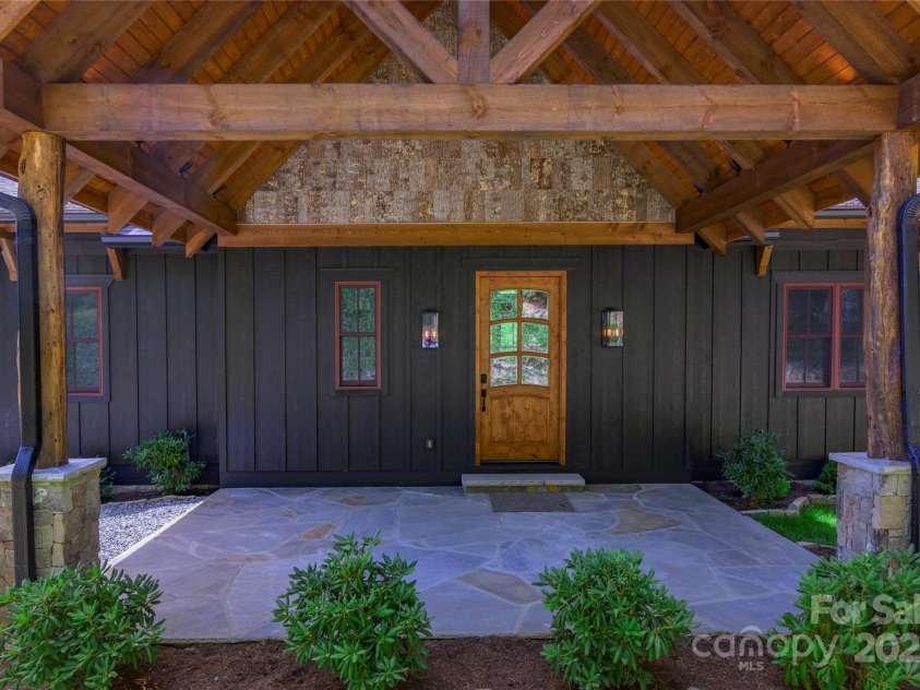 750 Silver Springs Drive, Banner Elk, NC 28604.  MLS# CAR4160928, YatesRealty ID 553. Covered porte-cochere entrance