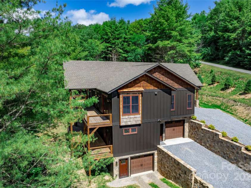 750 Silver Springs Drive, Banner Elk, NC 28604.  MLS# CAR4160928, YatesRealty ID 553. Majestic, private mountain & neighborhood pond views