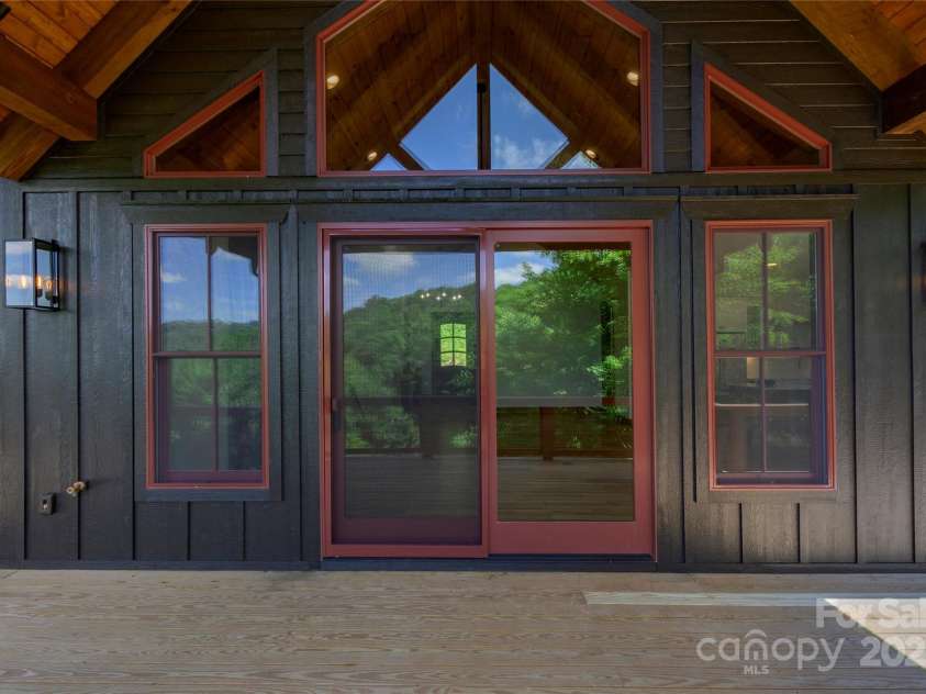 750 Silver Springs Drive, Banner Elk, NC 28604.  MLS# CAR4160928, YatesRealty ID 553. Over 1,200 square feet of outdoor space including main level porte-cochere, covered porches with majestic, private mountain & neighborhood pond views