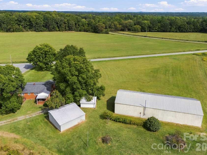 2925 Fallston Waco Road, Shelby, NC 28150.  MLS# CAR4430911, YatesRealty ID 55314. Aerial view of 4 structures