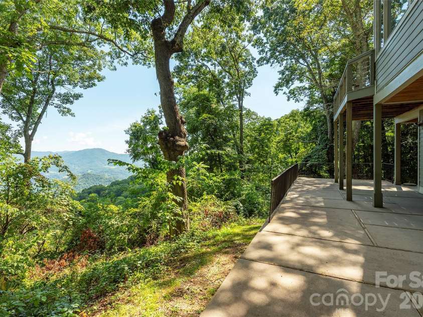 226 Strickland Drive, Waynesville, NC 28785.  MLS# CAR4407151, YatesRealty ID 55329. Beautiful views from lower back patio