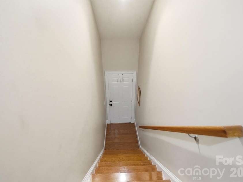 427 Dumbarton Street, Concord, NC 28027.  MLS# CAR4432005, YatesRealty ID 55339. Stairs from main level to garage