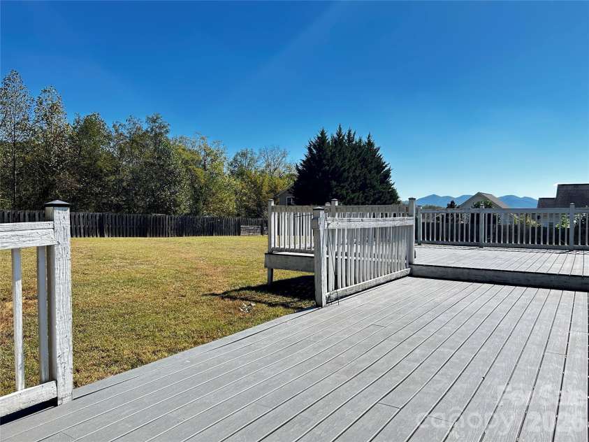 224 Pete Luther Road, Candler, NC 28715.  MLS# CAR4432613, YatesRealty ID 55340. The Deck Flows onto The Yard