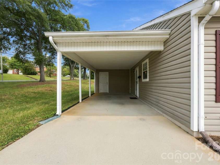1001 Old Chestnut Way, Cramerton, NC 28032.  MLS# CAR4431972, YatesRealty ID 55342. Carport with storage at the back.