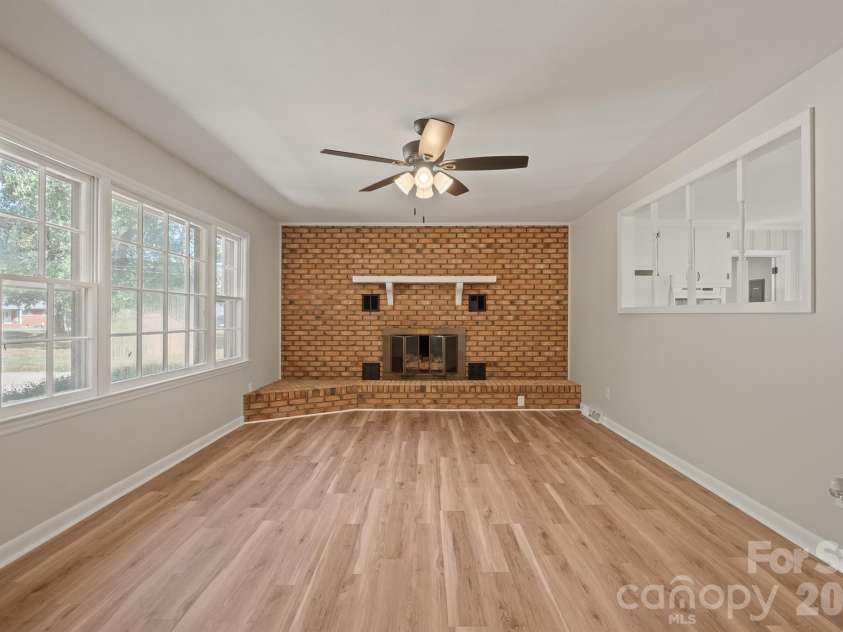 2530 Arnold Drive, Monroe, NC 28110.  MLS# CAR4432461, YatesRealty ID 55347. Living room with fireplace