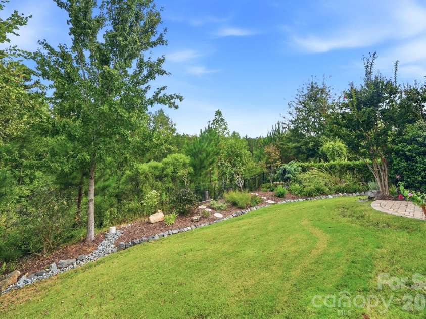 2029 Burton Point Court, Waxhaw, NC 28173.  MLS# CAR4431595, YatesRealty ID 55358. Backyard landscaping