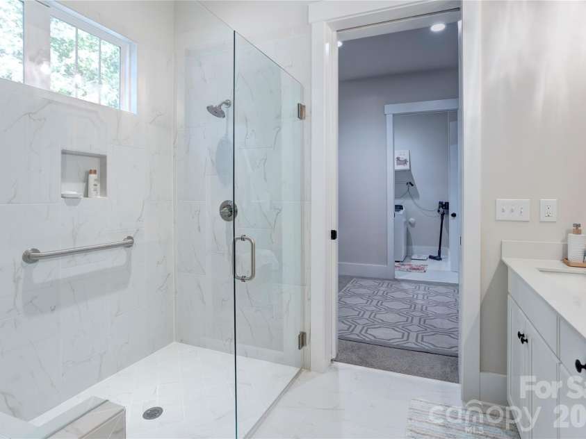 158 Fulworth Drive, Concord, NC 28027.  MLS# CAR4431518, YatesRealty ID 55361. A zero-entry shower offers easy, step-free access and a clean, modern look.