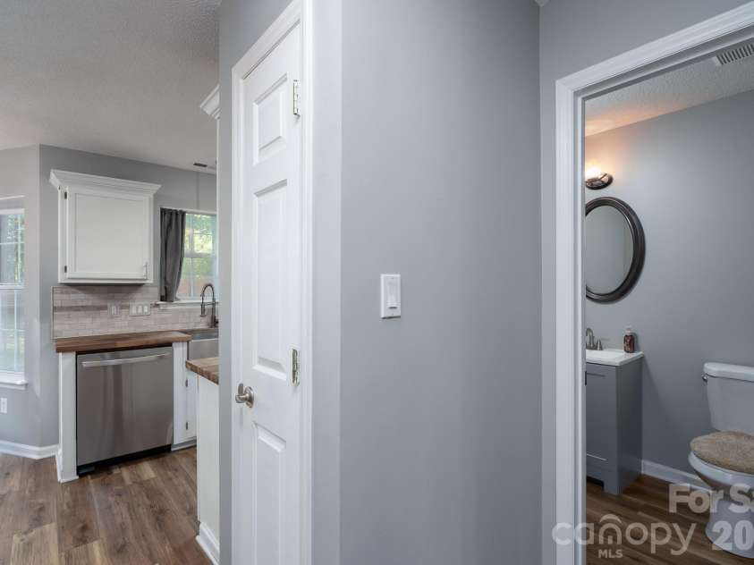14200 Lavender Trace Court, Charlotte, NC 28273.  MLS# CAR4430462, YatesRealty ID 55379. Half bathroom (downstairs) off kitchen