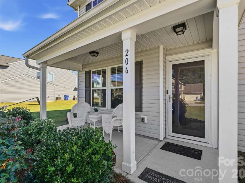206 Amberly Circle, Pageland, SC 29728.  MLS# CAR4430189, YatesRealty ID 55384. Rocking chair front porch