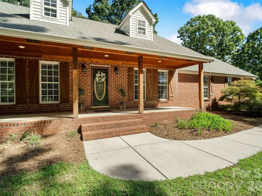 996 Beamguard Road, Clover, SC 29710.  MLS# CAR4430042, YatesRealty ID 55385. Front porch with cedar posts, trim and beadboard.