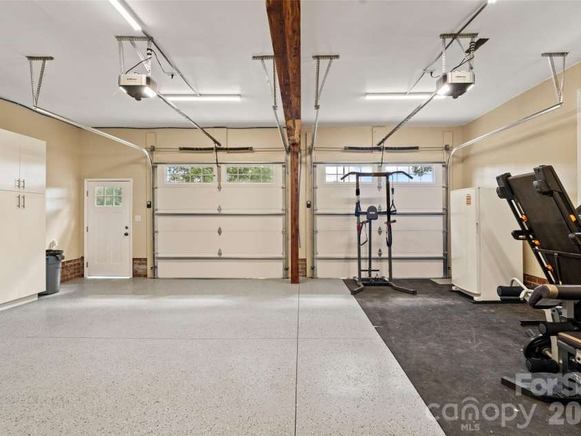 996 Beamguard Road, Clover, SC 29710.  MLS# CAR4430042, YatesRealty ID 55385. Heated and cooled garage with epoxy flooring and cedar accents [32.7ft x 27ft]