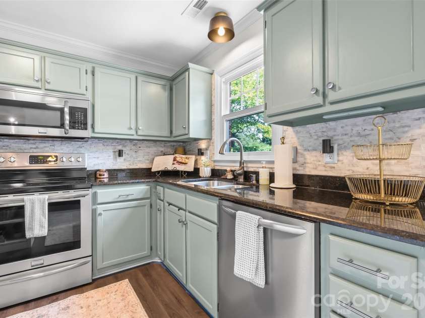 241 Linville Drive, Matthews, NC 28105.  MLS# CAR4429436, YatesRealty ID 55390. 
