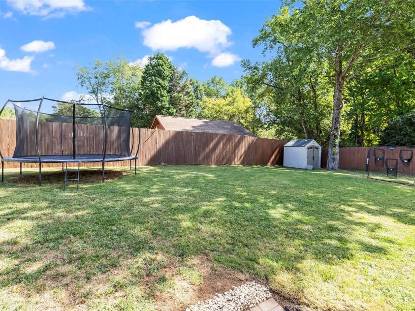 241 Linville Drive, Matthews, NC 28105.  MLS# CAR4429436, YatesRealty ID 55390. 
