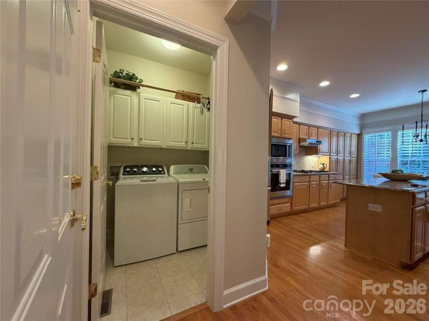 11437 Corliss Avenue, Charlotte, NC 28277.  MLS# CAR4429064, YatesRealty ID 55399. Laundry room off kitchen