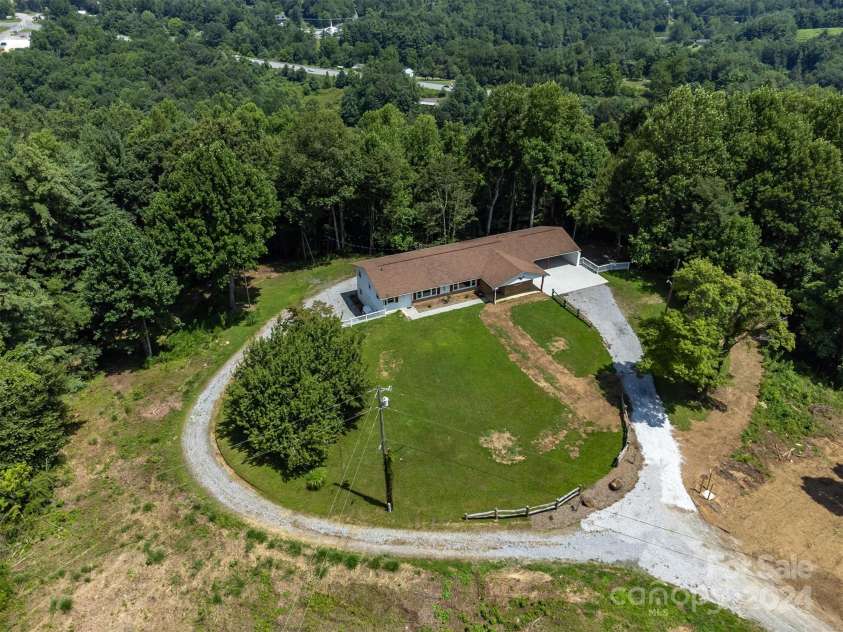 468 Deer Park Lake Road, Spruce Pine, NC 28777.  MLS# CAR4068097, YatesRealty ID 5542. This view is showing the additional driveway to the lower level units