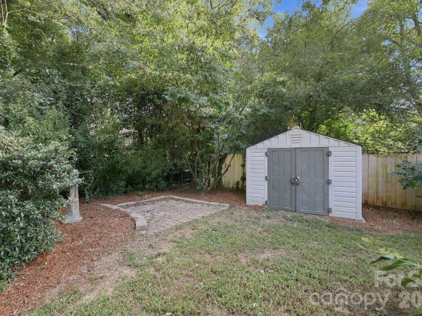 123 Hillside Avenue, Concord, NC 28025.  MLS# CAR4432576, YatesRealty ID 55421. Garden area with shed